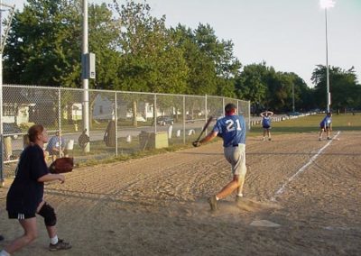 adults playing baseball