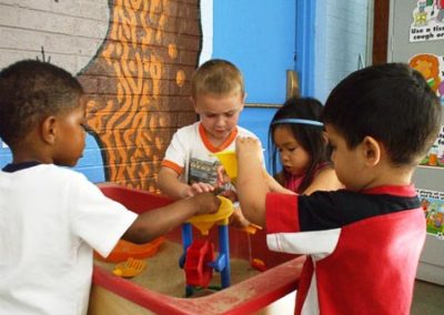 children playing with sand table